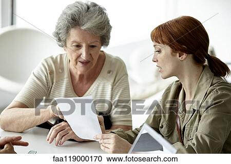 Mother and daughter reading prescription View Large Photo Image Stock Image - Mother and daughter reading prescription. Fotosearch