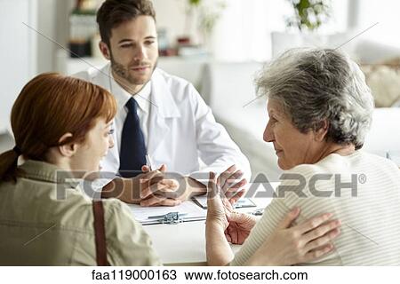 Mother and daughter talking in clinic View Large Photo Image Stock Image - Mother and daughter talking in clinic. Fotosearch