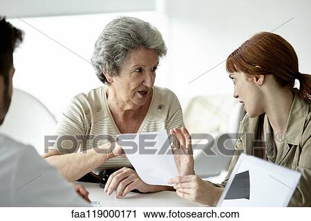 Mother and daughter talking in clinic View Large Photo Image Stock Image - Mother and daughter talking in clinic. Fotosearch