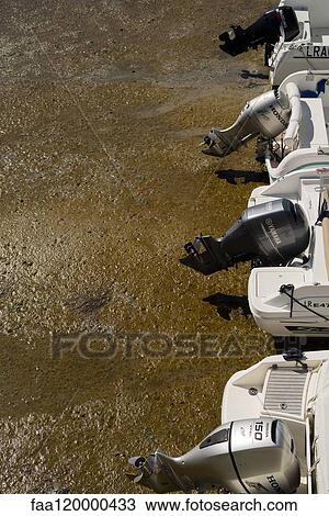 Motorboats moored on shore View Large Photo Image Stock Image - Motorboats moored on shore. Fotosearch