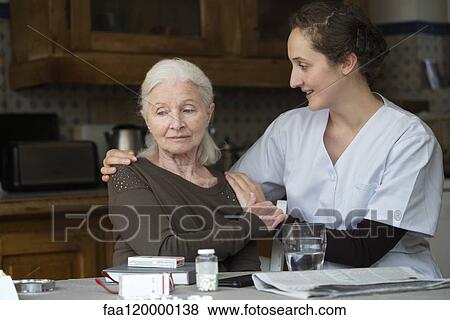 Nurse consoling patient View Large Photo Image Stock Photo - Nurse consoling patient. Fotosearch