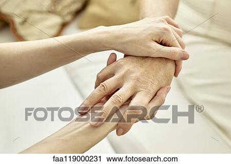 Nurse holding patient's hand View Large Photo Image Stock Image - Nurse holding patient's hand. Fotosearch