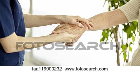 Nurse holding patient's hand View Large Photo Image Stock Image - Nurse holding patient's hand. Fotosearch