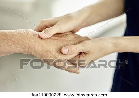Nurse holding patient's hand View Large Photo Image Stock Photo - Nurse holding patient's hand. Fotosearch