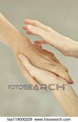 Nurse holding patient's hand View Large Photo Image Stock Photo - Nurse holding patient's hand. Fotosearch