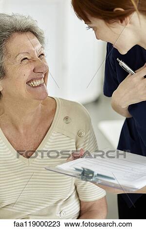 Nurse talking to patient View Large Photo Image Stock Image - Nurse talking to patient. Fotosearch