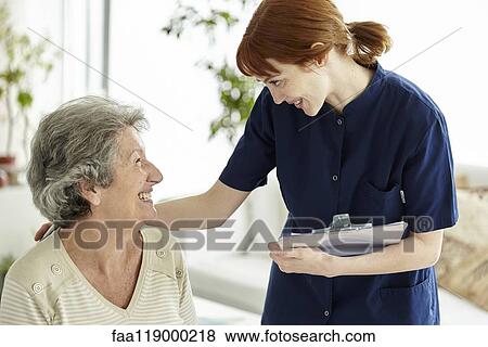 Nurse talking to patient View Large Photo Image Stock Photo - Nurse talking to patient. Fotosearch