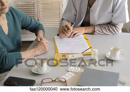 Patient talking with doctor View Large Photo Image Stock Image - Patient talking with doctor. Fotosearch