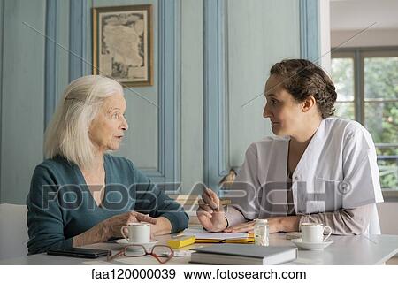 Patient talking with doctor View Large Photo Image Stock Photo - Patient talking with doctor. Fotosearch