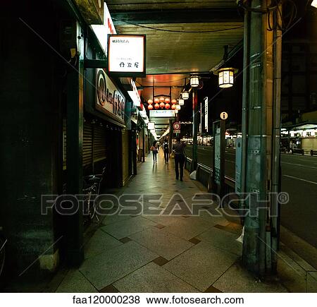 People walking on sidewalk in Gion district View Large Photo Image Stock Photo - People walking on sidewalk in Gion district. Fotosearch