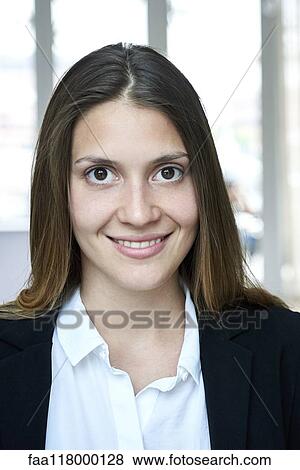 Portrait of businesswoman standing in hotel lobby View Large Photo Image Stock Photo - Portrait of businesswoman standing in hotel lobby. Fotosearch