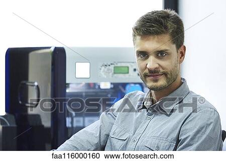 Stock Image - Portrait of engineer in office. Fotosearch