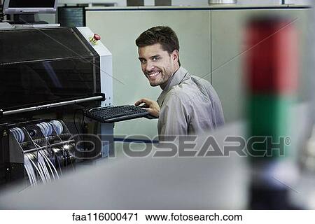 Portrait of engineer sitting in office View Large Photo Image Stock Image - Portrait of engineer sitting in office. Fotosearch