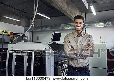 Portrait of engineer standing in office View Large Photo Image Stock Image - Portrait of engineer standing in office. Fotosearch