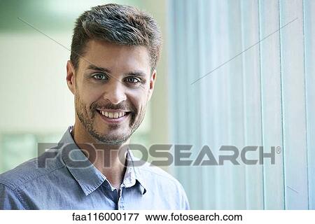 Portrait of engineer standing in office View Large Photo Image Stock Photo - Portrait of engineer standing in office. Fotosearch