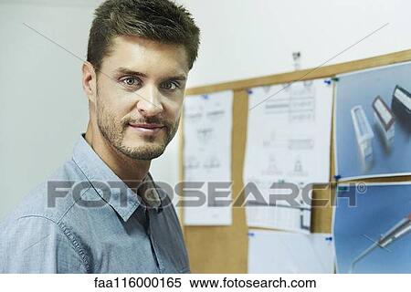 Portrait of engineer standing in office View Large Photo Image Stock Photography - Portrait of engineer standing in office. Fotosearch