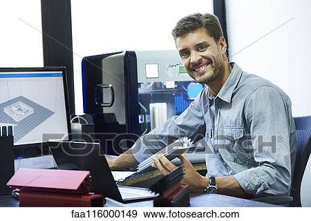 Portrait of engineer working in office View Large Photo Image Stock Photo - Portrait of engineer working in office. Fotosearch