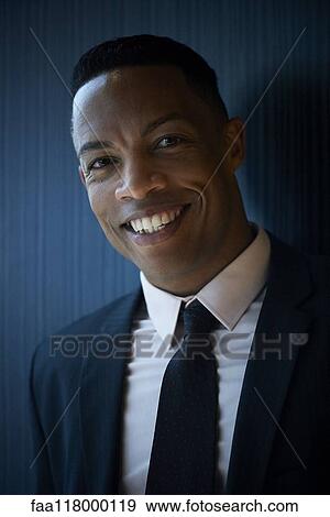 Stock Photo - Portrait of smiling businessman. Fotosearch