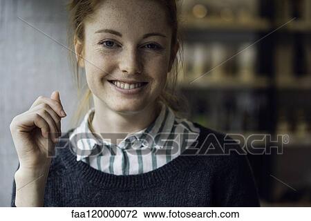 Stock Image - Portrait of smiling woman. Fotosearch