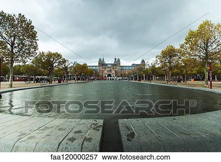 Rijksmuseum seen from Museumplein in Amsterdam View Large Photo Image Stock Photo - Rijksmuseum seen from Museumplein in Amsterdam. Fotosearch