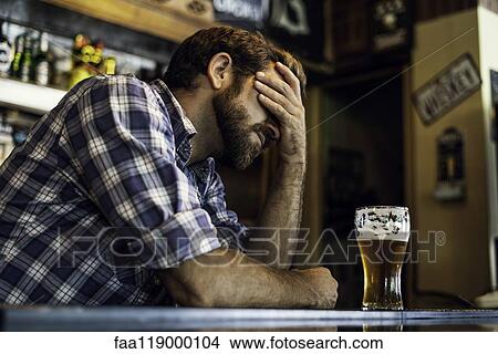 Sad man sitting in beer bar View Large Photo Image Picture - Sad man sitting in beer bar. Fotosearch