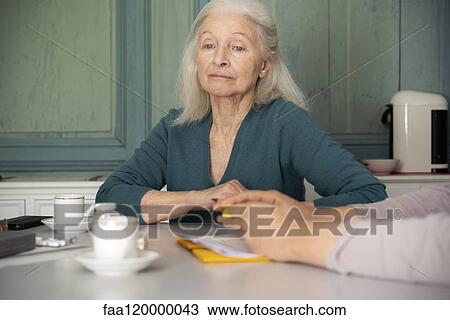 Sad patient sitting in clinic View Large Photo Image Stock Image - Sad patient sitting in clinic. Fotosearch