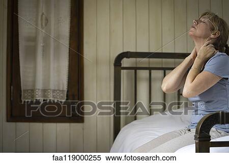Sad woman sitting on bed View Large Photo Image Stock Photography - Sad woman sitting on bed. Fotosearch