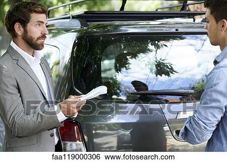 Salesman talking with client View Large Photo Image Stock Photograph - Salesman talking with client. Fotosearch