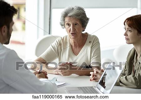 Senior patient talking with doctor View Large Photo Image Stock Photography - Senior patient talking with doctor. Fotosearch