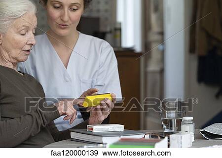 Senior patient talking with nurse View Large Photo Image Stock Photo - Senior patient talking with nurse. Fotosearch