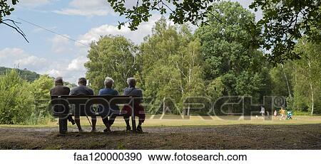 Senior people sitting in park View Large Photo Image Stock Image - Senior people sitting in park. Fotosearch