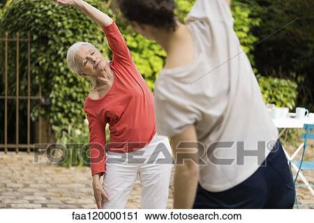 Senior woman doing exercise View Large Photo Image Stock Image - Senior woman doing exercise. Fotosearch