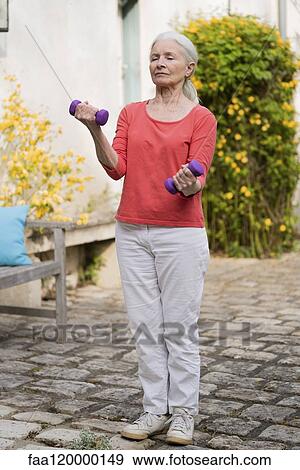 Senior woman doing exercise View Large Photo Image Stock Photo - Senior woman doing exercise. Fotosearch