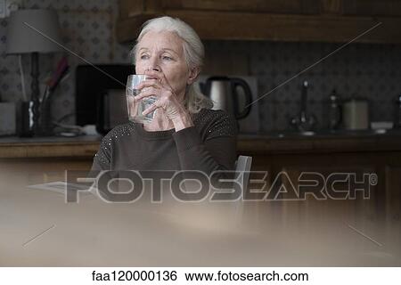 Senior woman drinking water View Large Photo Image Stock Photograph - Senior woman drinking water. Fotosearch