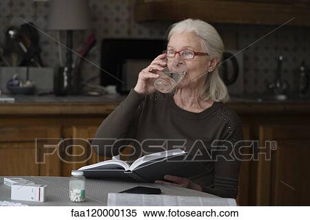 Senior woman drinking water View Large Photo Image Stock Photography - Senior woman drinking water. Fotosearch