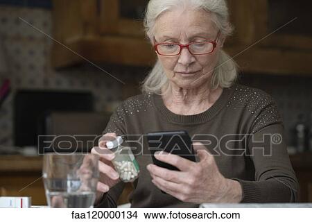 Senior woman using smart phone View Large Photo Image Picture - Senior woman using smart phone. Fotosearch