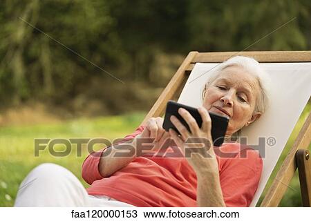 Senior woman using smart phone View Large Photo Image Stock Image - Senior woman using smart phone. Fotosearch