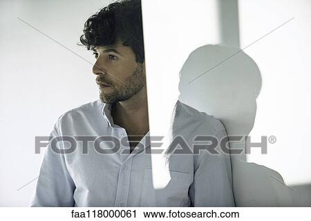 Stock Image - Serious business people looking away. Fotosearch