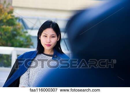 Serious woman walking View Large Photo Image Stock Photo - Serious woman walking. Fotosearch