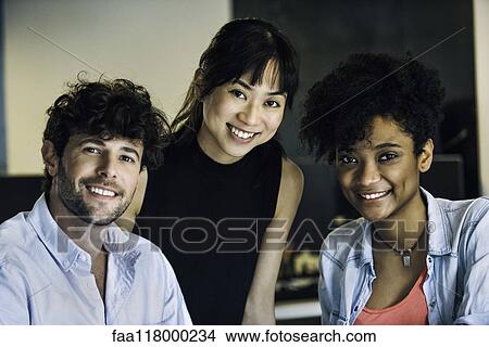 Smiling business people in office View Large Photo Image Picture - Smiling business people in office. Fotosearch