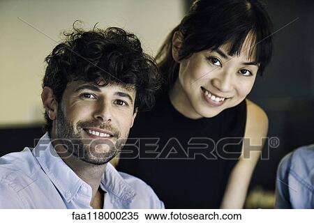 Smiling business people in office View Large Photo Image Stock Photography - Smiling business people in office. Fotosearch