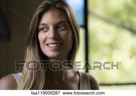 Smiling young woman View Large Photo Image Stock Photo - Smiling young woman. Fotosearch