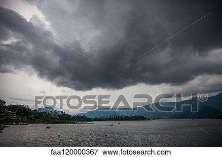 Storm clouds over lake View Large Photo Image Stock Photo - Storm clouds over lake. Fotosearch