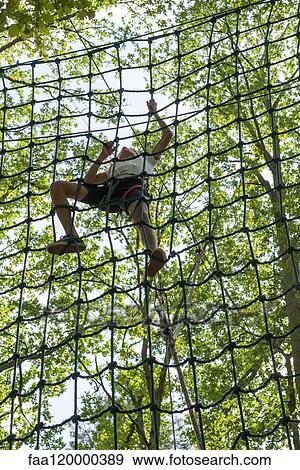 teenage girl climbing on cargo net View Large Photo Image Stock Photo - teenage girl climbing on cargo net. Fotosearch