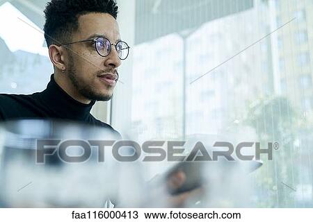 Thoughtful businessman holding digital tablet View Large Photo Image Stock Image - Thoughtful businessman holding digital tablet. Fotosearch