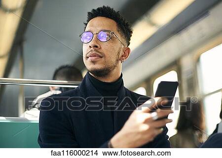 Thoughtful businessman with smartphone View Large Photo Image Picture - Thoughtful businessman with smartphone. Fotosearch