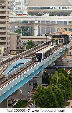 Train moving on elevated track View Large Photo Image Stock Photo - Train moving on elevated track. Fotosearch