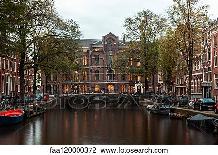 View of Dutch houses and bridge over canal View Large Photo Image Stock Image - View of Dutch houses and bridge over canal. Fotosearch