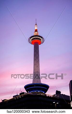 Stock Image - View of Kyoto Tower against blue sky. Fotosearch