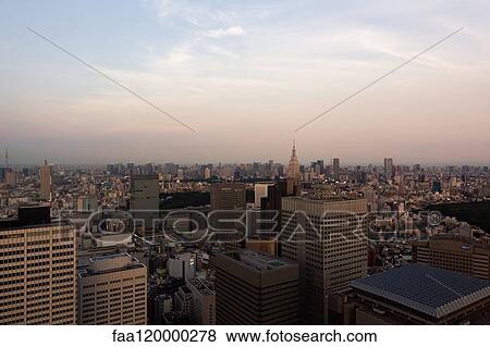 View of modern skyscrapers at sunset View Large Photo Image Stock Photo - View of modern skyscrapers at sunset. Fotosearch